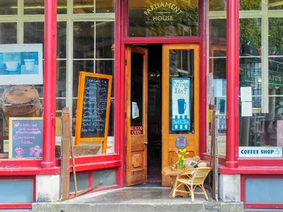 an open door of a coffee shop with a table in it at Gors Y Gader in Llanelltyd