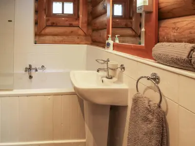 a bathroom with a sink and a mirror at Brynallt Country Park in Ellesmere
