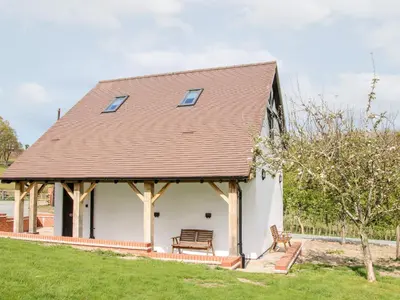 a large white building with a wooden roof at Gerry's Place in Church Stretton