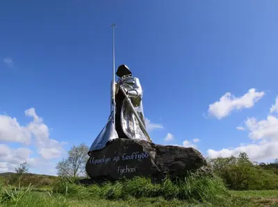 a statue of a bell on a rock in a field at 3 Bed in Bethlehem oc-waw219 in Llangadog