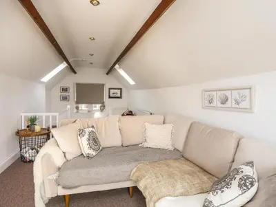 a living room with a couch and a table at Arran House in Barmouth