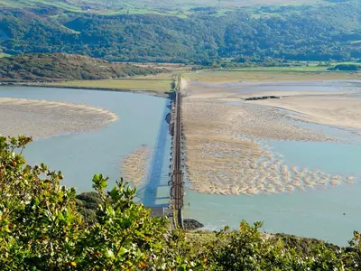 an aerial view of a bridge over a body of water at Arran House in Barmouth