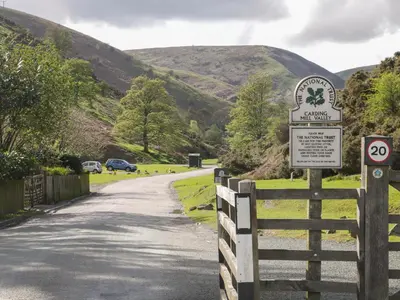a sign on the side of a road with a fence at The Stables in Shrewsbury