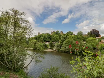 a view of a river with a city in the background at 2 The Villa in Ludlow