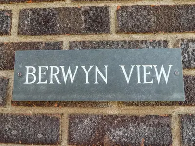 a sign on a brick sidewalk with the word benyryn view at Berwyn View in Welshpool