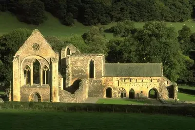 an old stone church in the middle of a field at Hillside Cottage, countryside views near Llangollen in Corwen