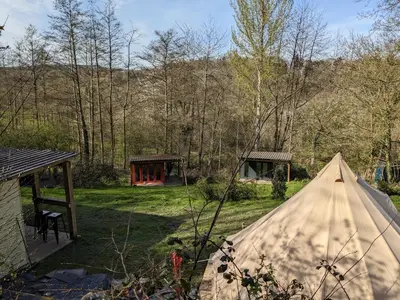 a tent in the middle of a yard at Stay Wild Retreats 'Glamping Pods and Tents' in Wrexham