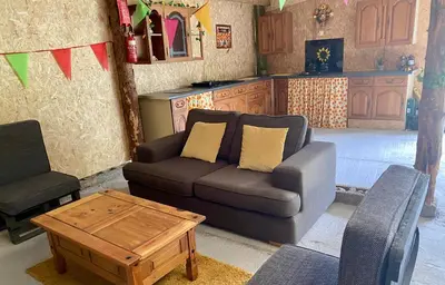 a living room with a couch and a coffee table at River View Glamping in Llandovery
