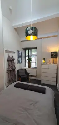 a bedroom with a large bed in a room at Cosy Spring Cottage at Pen Y Coed Hall in Dolgellau
