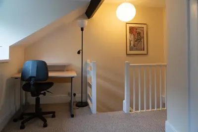 an office with a desk and a blue chair at Glasfryn Cottage Dolgellau in Dolgellau