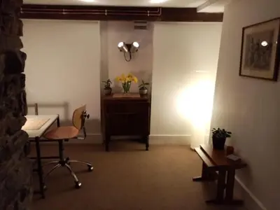 a room with a desk and a chair and a table at Bridge View Victorian Townhouse Central Aberystwyth Sleeps 6 in Aberystwyth