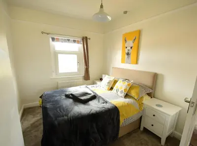 a small bedroom with a bed and a window at Old Street Terrace in Ludlow