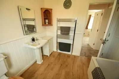 a bathroom with a sink and a mirror at Old Street Terrace in Ludlow