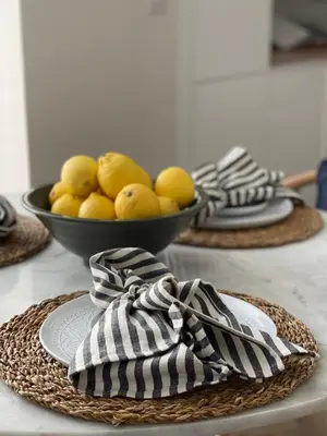 a bowl of lemons on a table with a bowl of fruit at Richardson Apartment in Aberaeron