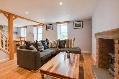 a living room with a couch and a table at 2 Bed in Tregaron oc-bow289 in Tregaron