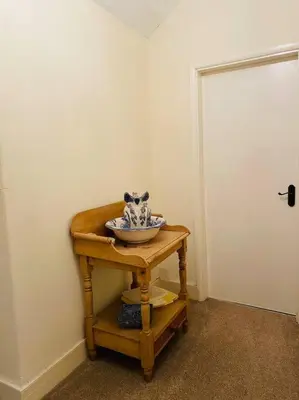 a room with a table with a bowl on it at Farmhouse Cottage set in beautiful countryside in Oswestry