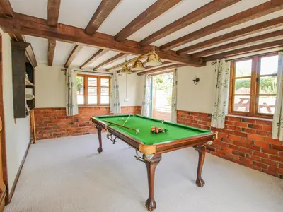 a room with a pool table in it at 46-47 Lydbury North in North Lydbury