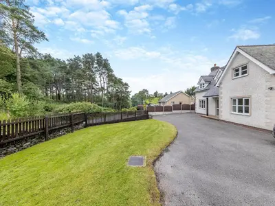 a driveway of a house with a fence at Cysgod Y Capel in Cerrigydrudion