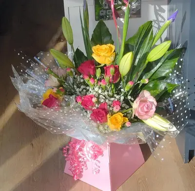 a bouquet of flowers sitting on a table at Shepherd's Watch Cottage - 5* Cyfie Farm with private hot tub in Llanfyllin