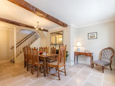 a dining room with a table and chairs at Turford House in Ludlow