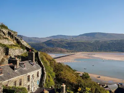 a view of the beach from the cliffs of a castle at 4A Victoria Place in Barmouth