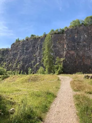 a dirt road in front of a rocky mountain at Mini haven in Oswestry