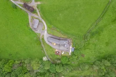 an aerial view of a house in a green field at 3 Bed in Machynlleth oc-bow321 in Cemmaes