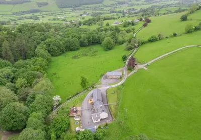 an aerial view of a farm in a field at 3 Bed in Machynlleth oc-bow321 in Cemmaes