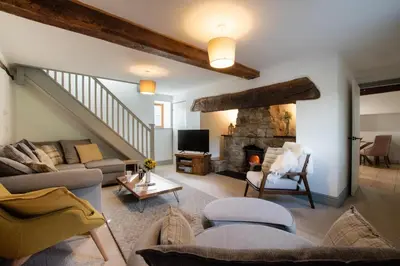 a living room with a couch and a fireplace at 3 Bed in Machynlleth oc-bow321 in Cemmaes