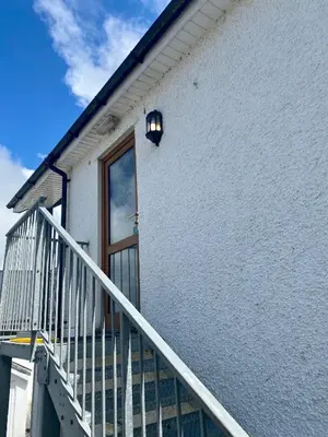 a staircase leading to a door of a house at Apartment 14 in Aberystwyth