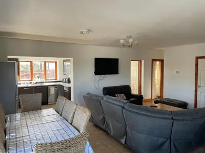 a living room with a couch and a table at Apartment 14 in Aberystwyth