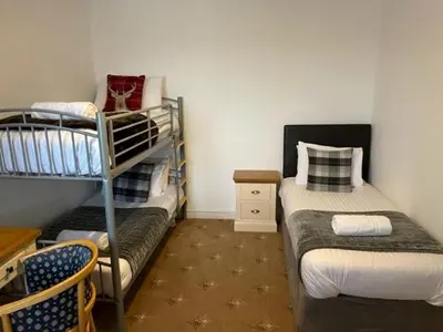 a small room with two bunk beds in it at Ty Bach in Aberystwyth