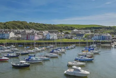 a bunch of boats are docked in a harbor at 2 Bed in Aberaeron oc-bow329 in Aberaeron
