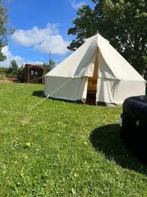 a large white tent in a field of grass at Tipi - Pengarreg in Aberystwyth