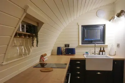a kitchen with a sink and a counter top at EASTRIDGE GLAMPING in Shrewsbury