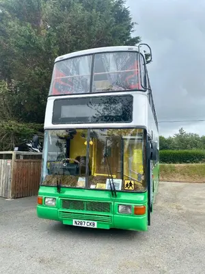 a double decker bus parked in a parking lot at Double Decker Bus in Aberystwyth