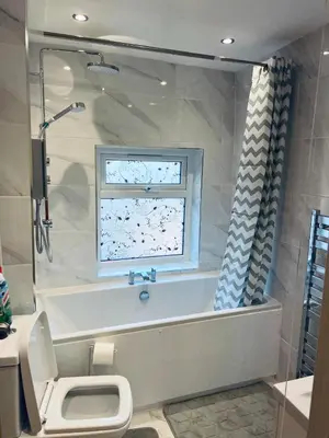 a bathroom with a tub and a toilet and a window at 21 ,North Street in Shrewsbury