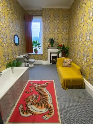 a living room with a tiger rug on the floor at Cader en suite at Pen Y Coed Hall exclusive Luxury Hot Tub in Dolgellau
