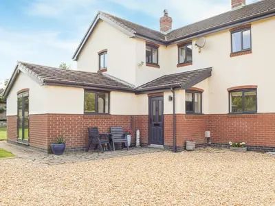 a detached house with a brick exterior at Hill View Lodge in Knucklas