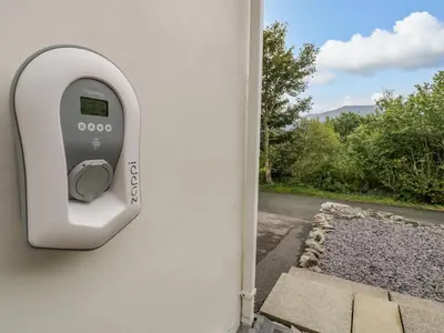 a door with a security camera on the side of a house at Lleifior in Dolgellau