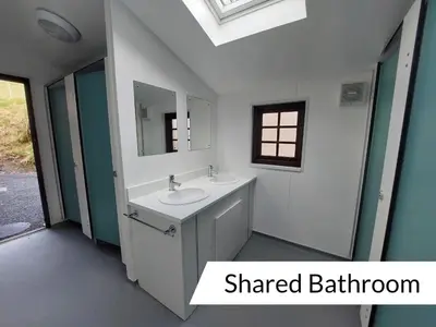 a bathroom with a sink and a mirror at Cwm Clyd - Carthouse in Rhayader