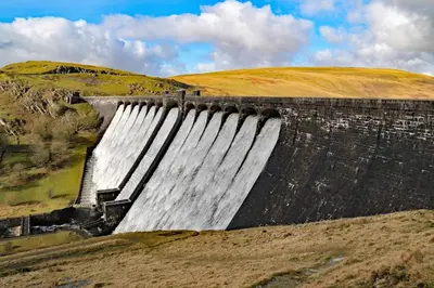 a dam in a field with at Cwm Clyd Longhouse in Llanwrthwl