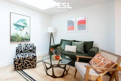 a living room with a green couch and chairs at Contemporary Townhouse - Free Parking - Central Shrewsbury in Shrewsbury