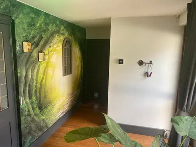 a hallway with a painting on the wall at Mountain Suite, Stunning Views, Brecon Beacons in Llanhamlach