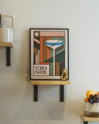 a framed picture on a shelf on a wall at Loft Fach in Tregaron