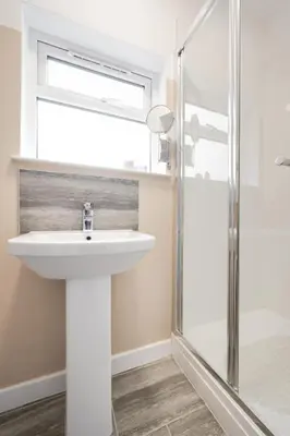 a bathroom with a sink and a shower at 2 Bed in Barmouth oc-wag721 in Barmouth