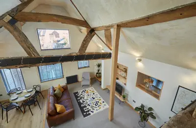 an overhead view of a living room with wooden beams at Kin Ludlow Rooms in Ludlow