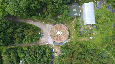 an aerial view of a building in the middle of a forest at Sapphire forest garden shepherd’s hut in Church Stretton