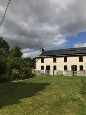 a large white house with a large yard at Cobblers Cottage in Brecon Beacons in Brecon
