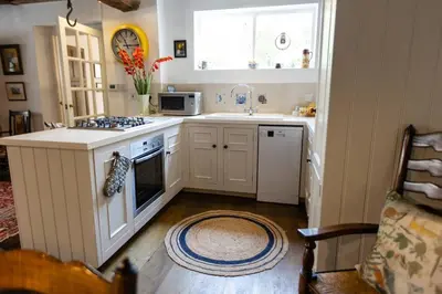 a kitchen with a sink and a stove top oven at Magical period house in the heart of Ludlow - Pass the Keys in Ludlow